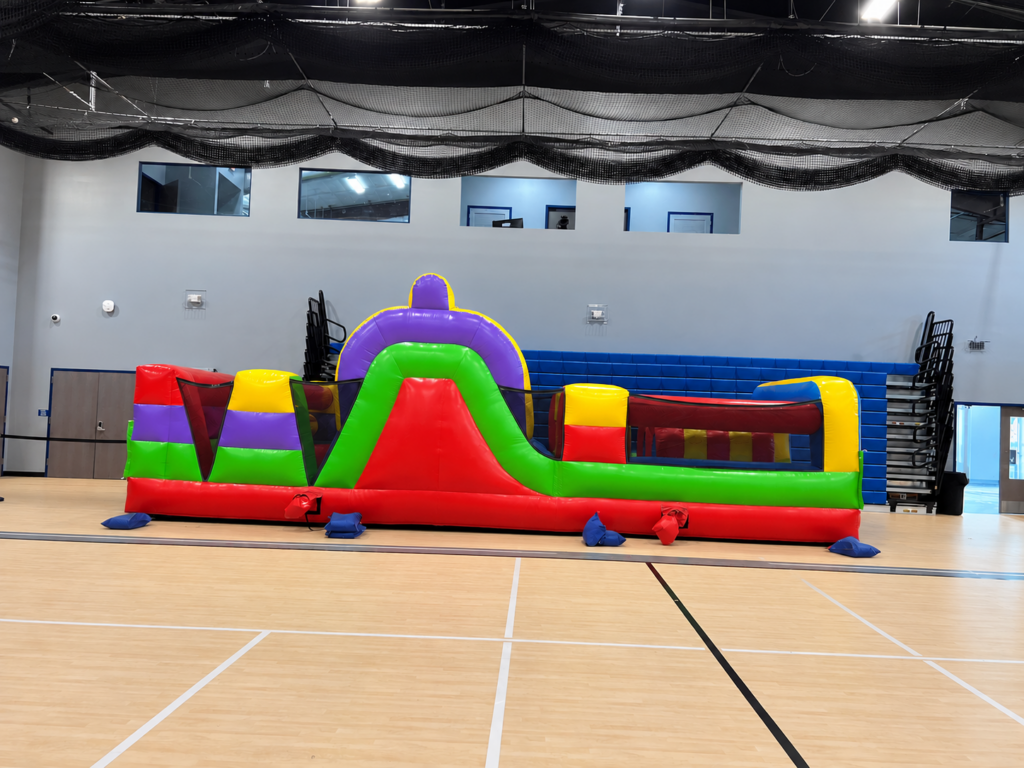 Colorful Inflatable Obstacle Course in Gymnasium